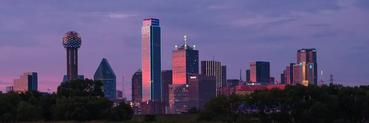 Dallas, Texas skyline reflected in water at sunset